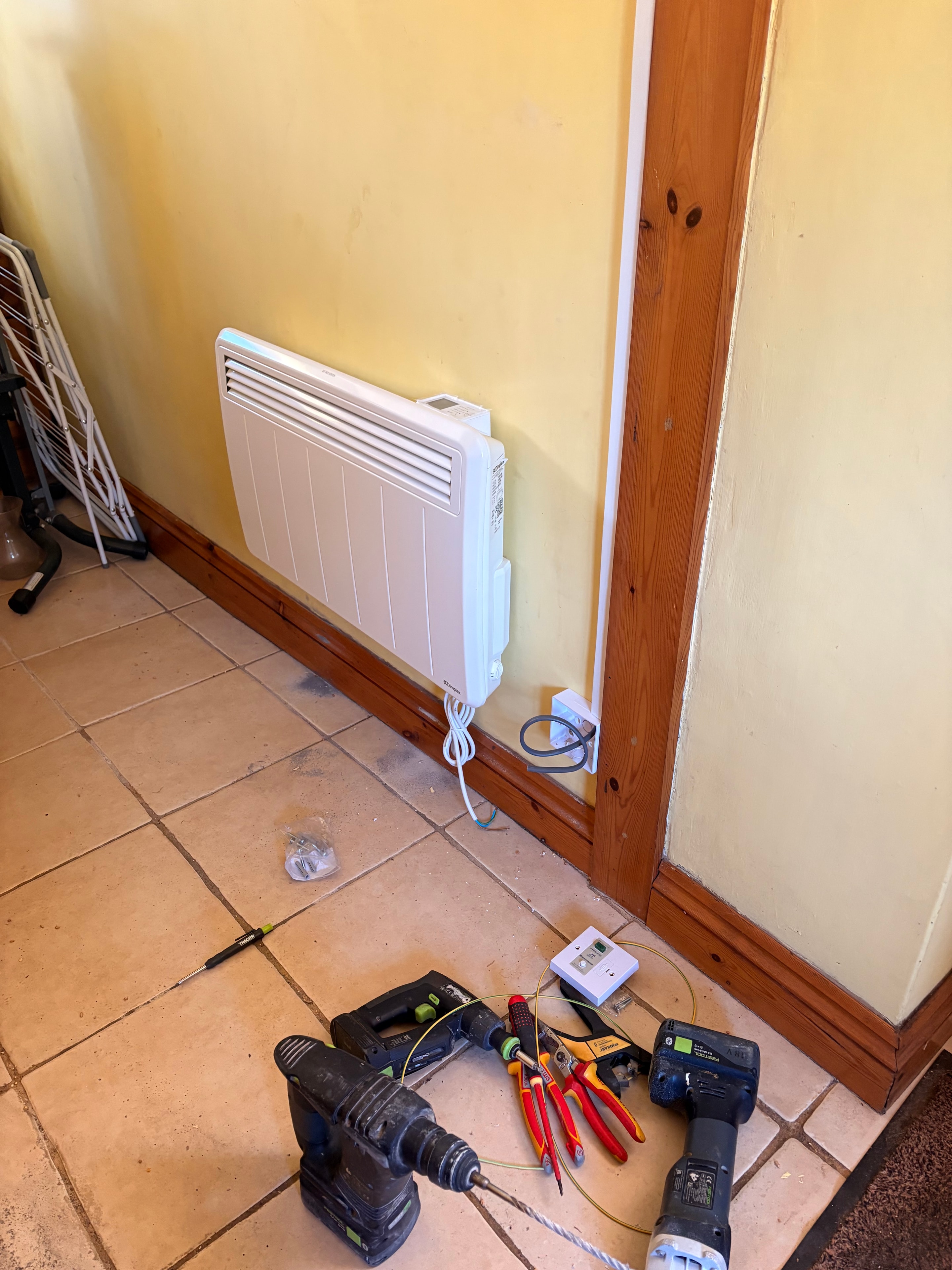 Storage heater installed in hallway/utility area — Goodmayes government grant installation