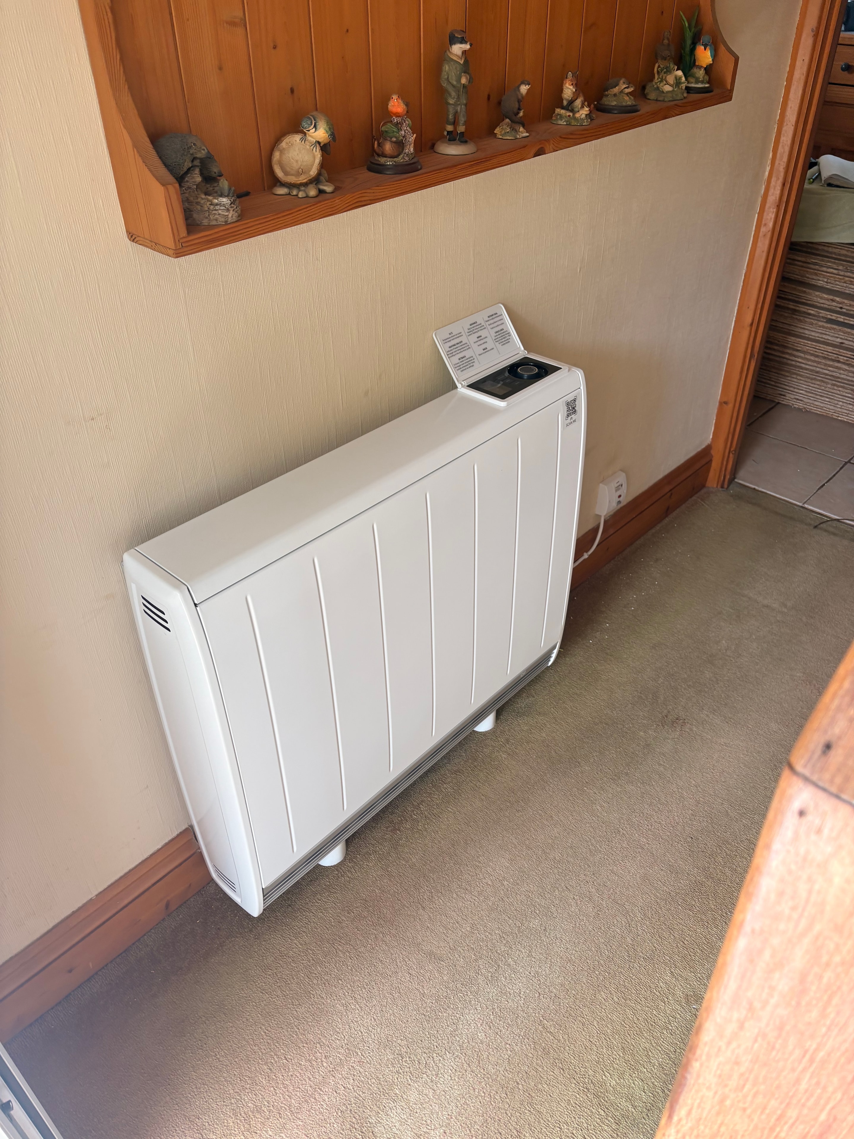 Completed storage heater on lounge wall — Goodmayes government grant installation