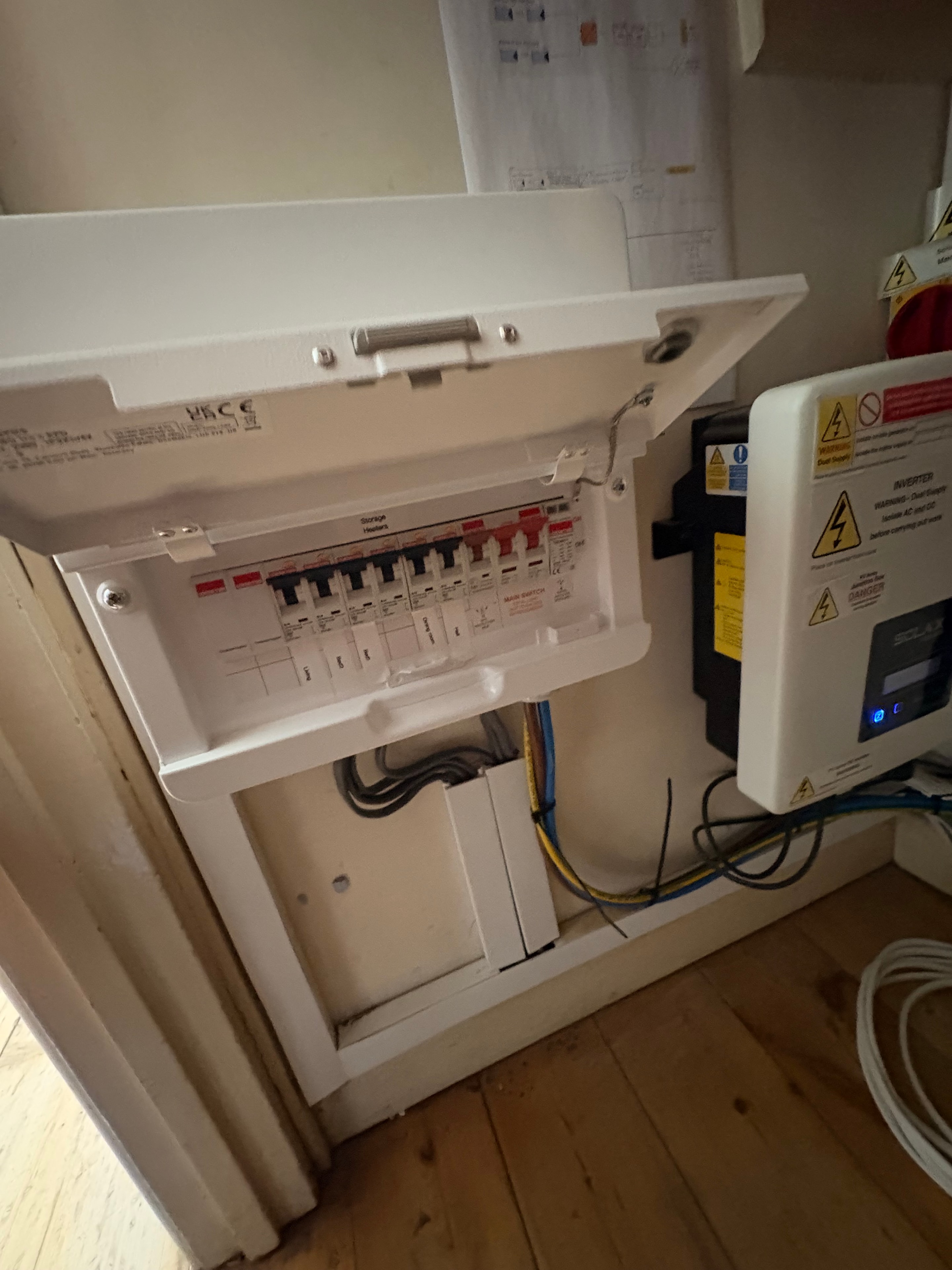 Inside the new consumer unit showing three dedicated storage heater circuits — neat wiring and correctly rated MCBs