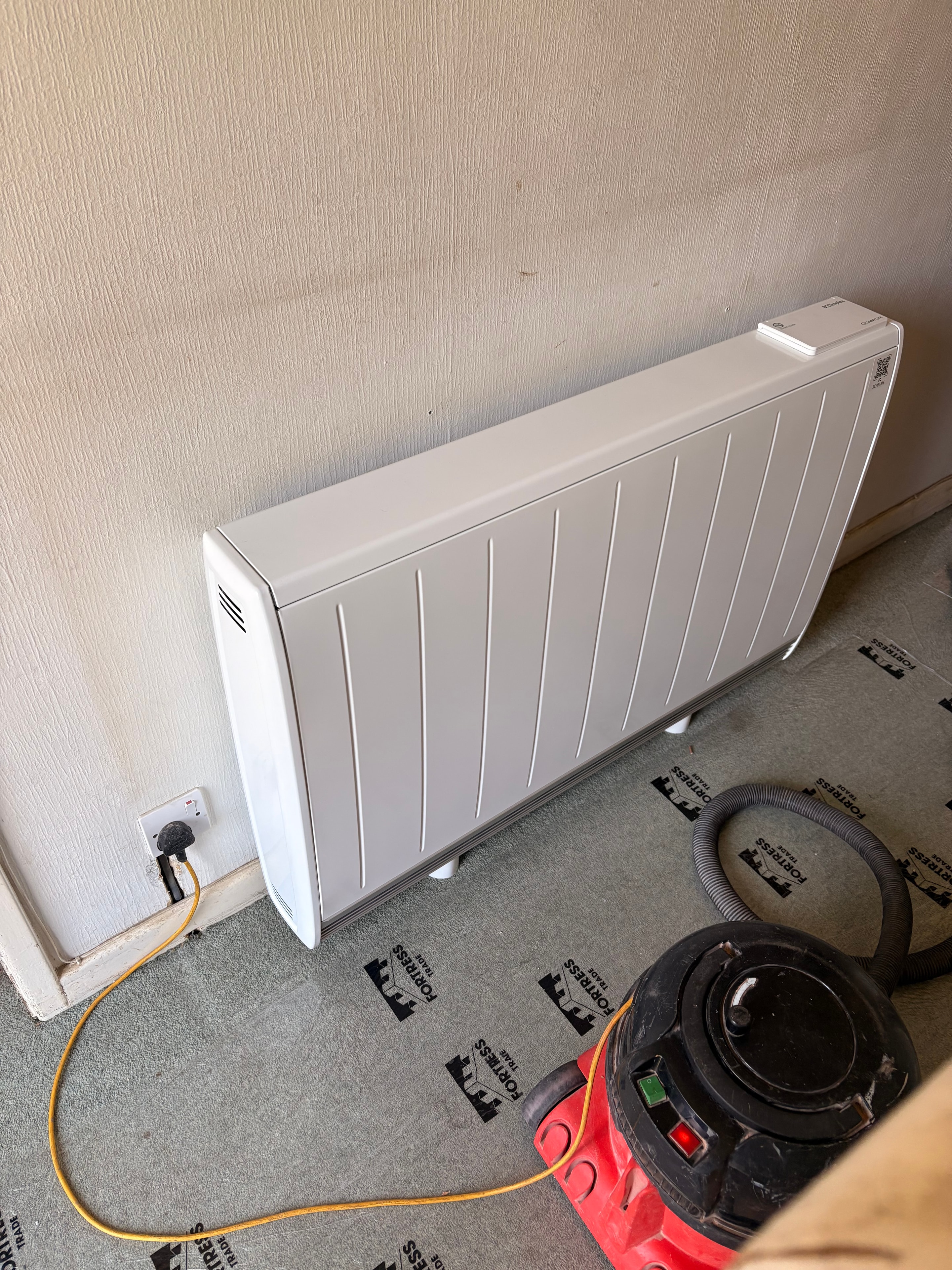 Storage heater unit ready for installation — new dedicated circuit and switched connection unit in place