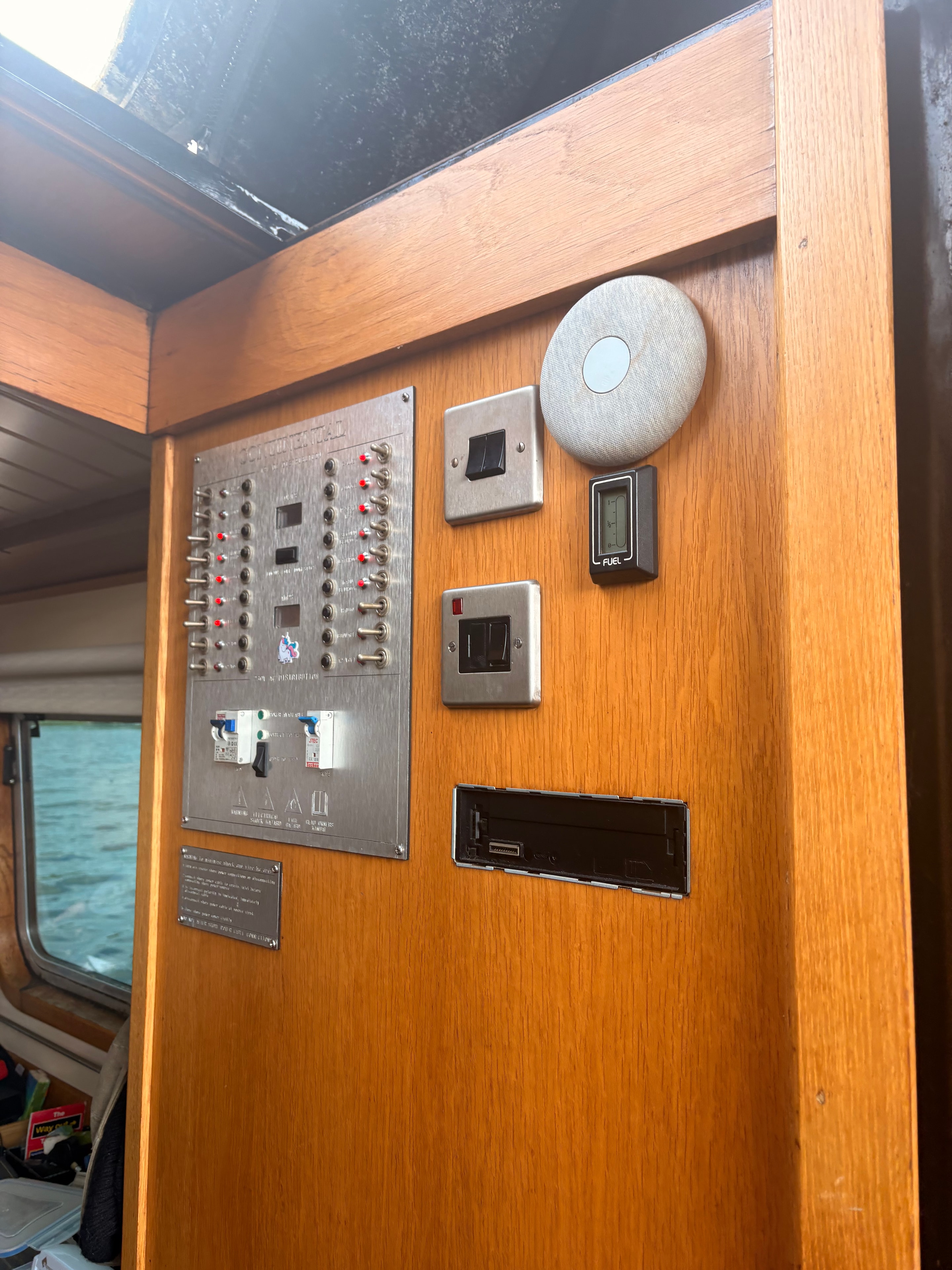 New battery isolator switch installed in boat battery compartment at Thames Ditton marina — replacement rotary switch with correct rating for the battery bank