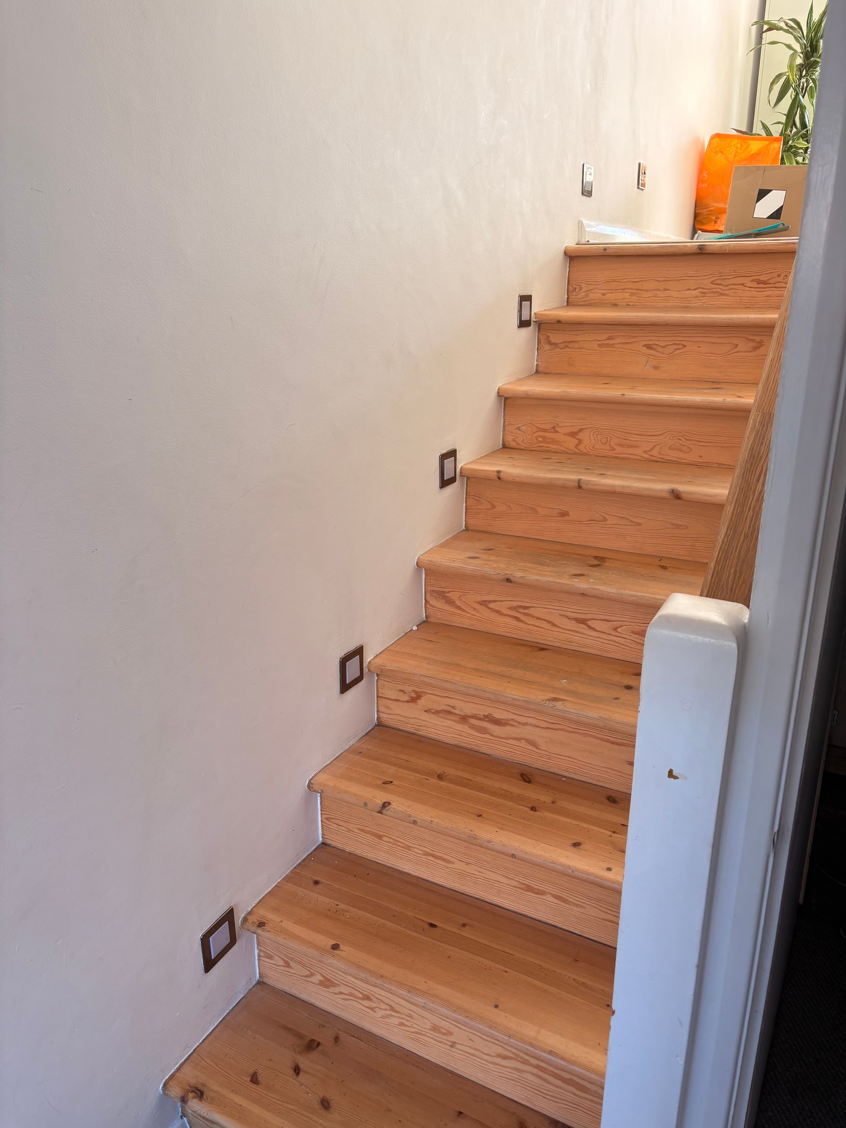 Completed 230V LED stair lights on the first staircase — lights off