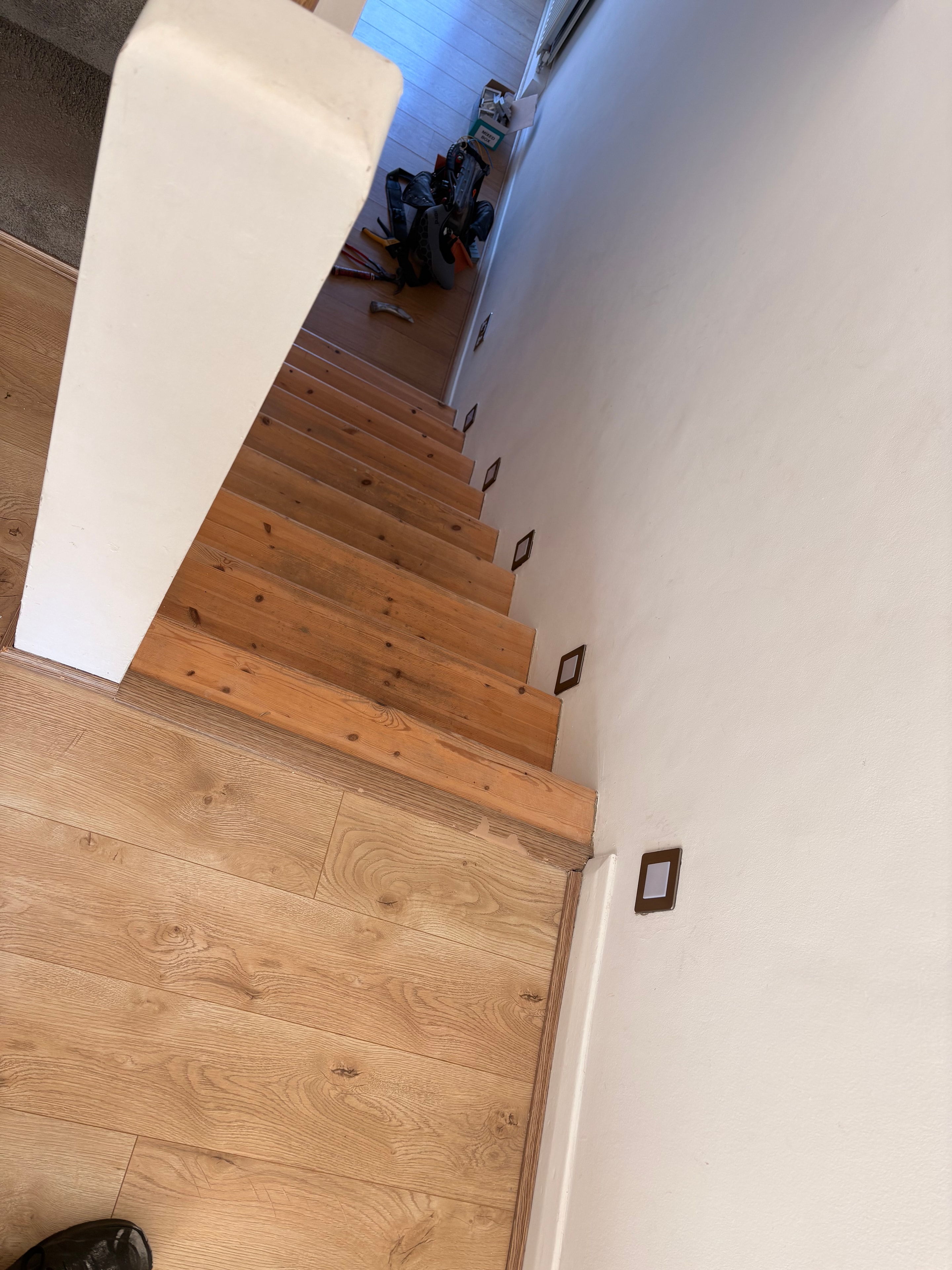 Completed 230V LED stair lights illuminated on the second staircase