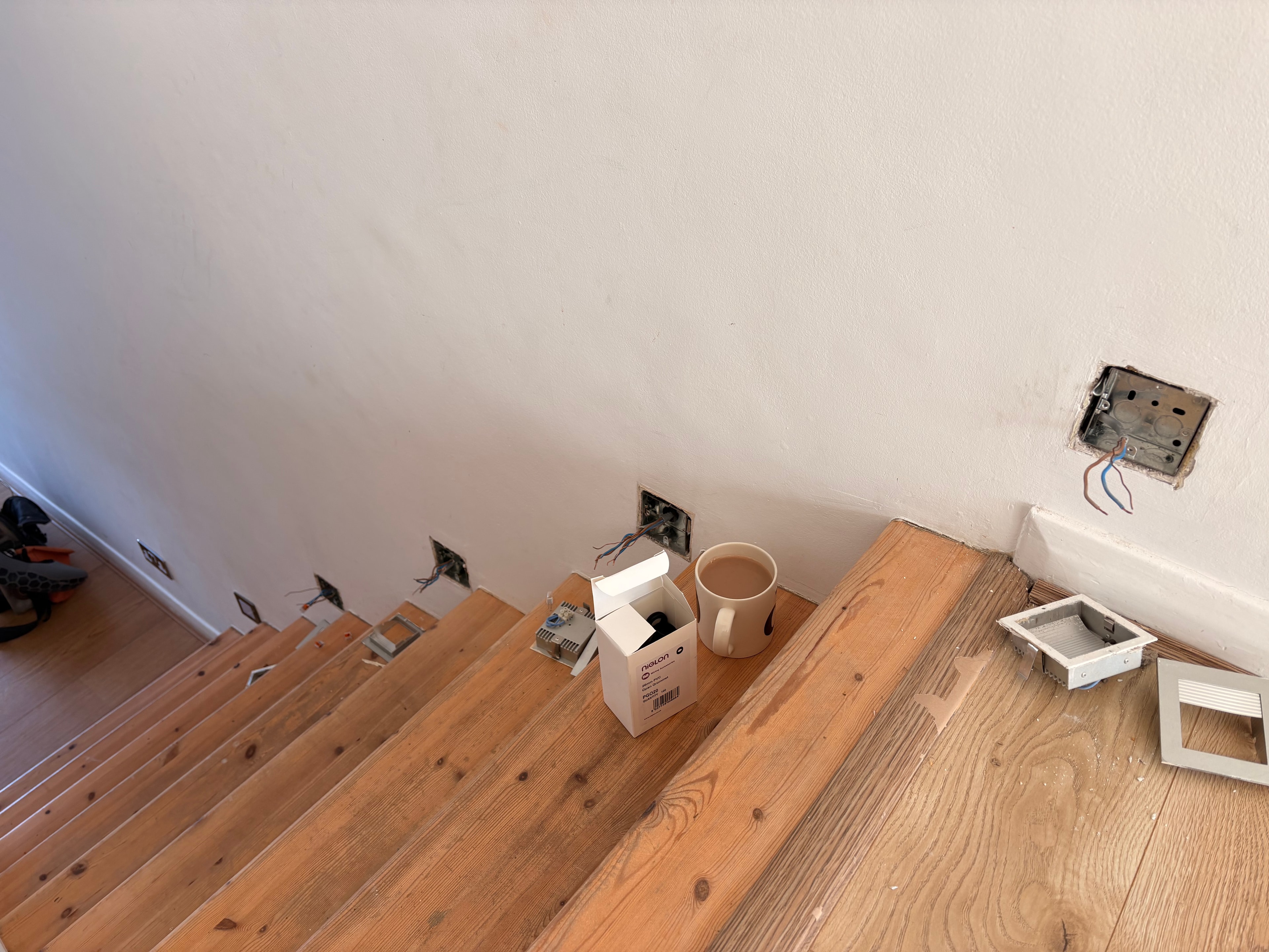 35mm flush back boxes chased into the staircase wall ready for wiring